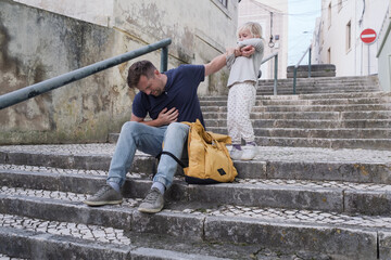 A Father Having a Health Problem and His Little Daughter Trying to Help