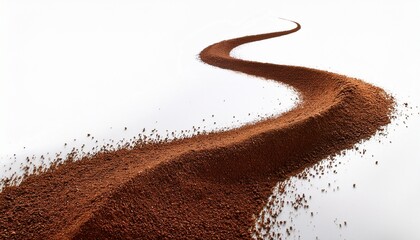 Coffee Grounds In A Flowing Curved Stream Against White