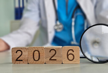 Future healthcare trends represented with wooden blocks and medical tools in a clinic