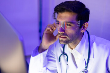 Portrait hispanic Doctor scientist working with desktop computer in laboratory. Science, chemistry and technology. online medicine, research or communication