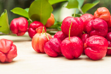 acerola cherry on wood top table
