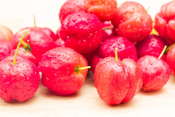 acerola cherry on wood top table