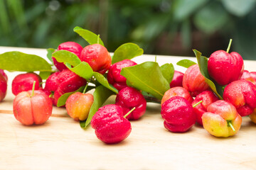 acerola cherry on wood top table