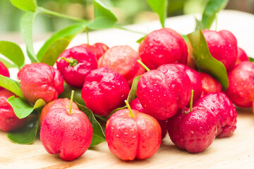 acerola cherry on wood top table