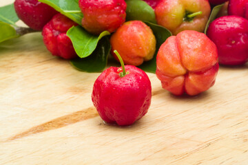 acerola cherry on wood top table