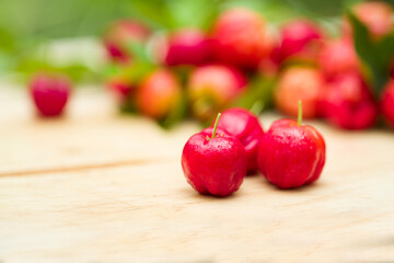 acerola cherry on wood top table
