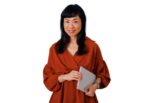 Asian businesswoman smiling and posing for portrait, holding a tablet, displaying confidence and professionalism
