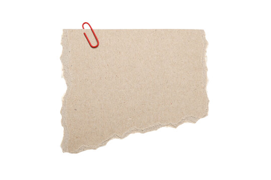 Torn kraft paper sheet with red paperclip isolated on white background, ripped textured cardboard note for messages, labeling, crafts, journaling,