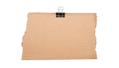 Torn corrugated cardboard sheet with metal binder clip isolated on transparent background, blank kraft paper board for notes, messages, labeling, packaging design, crafts, scrapbooking, 
