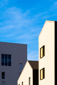Modern architecture housing in Montpellier France emphasizing geometric minimalism with a clean facade, sharp angles and strong daylight contrast
