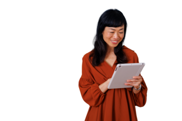 Asian woman smiling and interacting with tablet, browsing online content, showing connectivity and digital lifestyle on transparent background