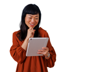 Asian woman smiling while using digital tablet for browsing, thinking about online content, transparent background
