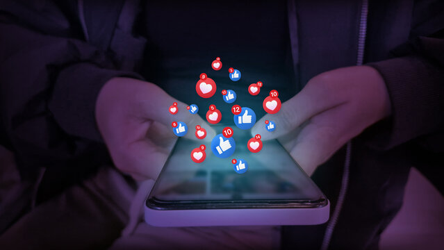 Smartphone with Floating Social Media Reaction Icons Representing Digital Engagement