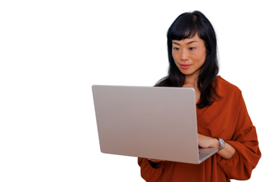 Asian businesswoman focused on work or study using a laptop. Transparent background for easy compositing - Powered by Adobe