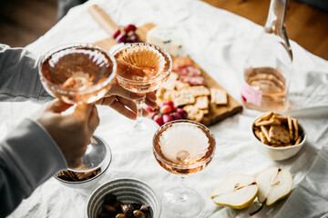 Glasses of rose wine seen during a dinner party of a celebration.