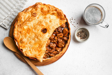 Beef steak pie with dark beer gravy and crispy puff pastry