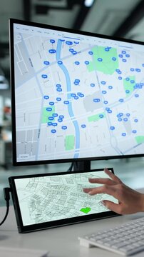 Real Estate Agent Looking At Cadastre Map