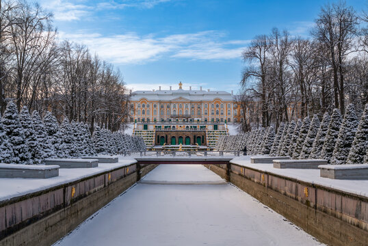 St. Petersburg, Russia, February 16, 2025: The Grand Peterhof Palace, the Grand Cascade Fountain and the Samsonovsky (Marine) Canal in the Lower Park of Peterhof on a sunny winter day