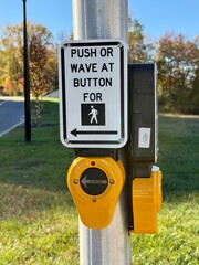 Push or wave crosswalk button with a shallow depth of field