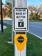 Push or wave crosswalk button with a shallow depth of field