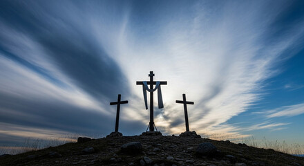 Three crosses stand silhouetted against a dramatic sky with streaks of light, evoking themes of faith, sacrifice, and hope on a rugged hilltop.