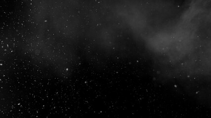 Obraz premium Freeze motion of snow and atmospheric smoke isolated on black background