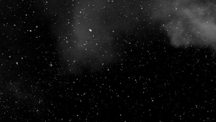 Freeze motion of snow and atmospheric smoke isolated on black background