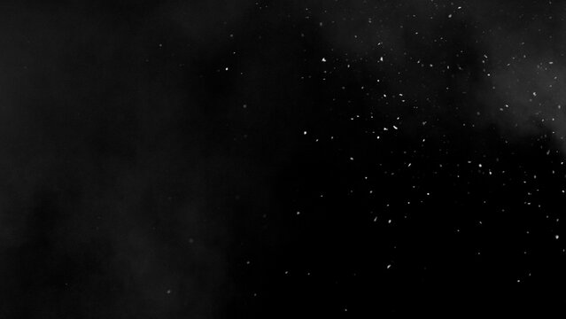 Freeze motion of snow and atmospheric smoke isolated on black background