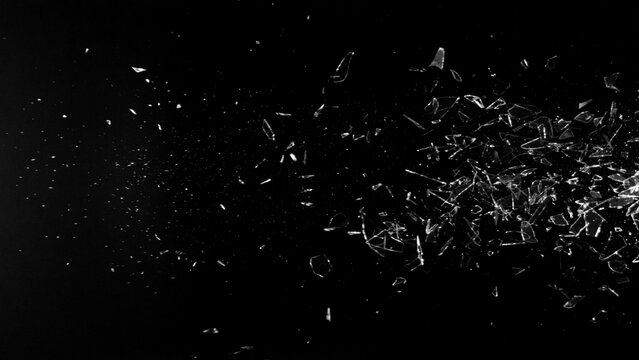 Freeze Motion Shot of Breaking Real Glass Isolated on Black Background