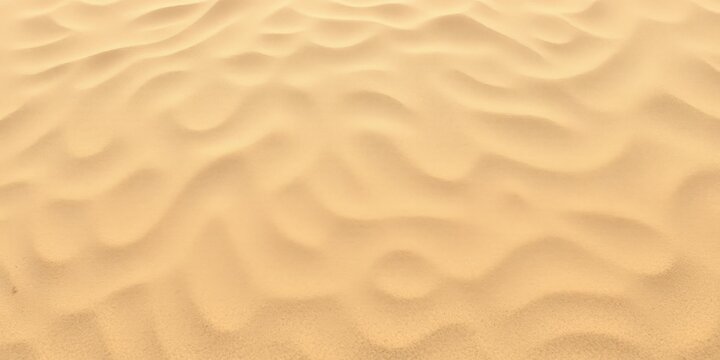 Close up abstract texture of golden sand dunes with soft light and shadow creating a natural wavy pattern