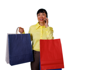 Asian woman shopping, holding colorful bags, talking on mobile phone, happy consumerism experience, transparent background