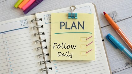 A planner with sticky note labeled Plan for daily activities