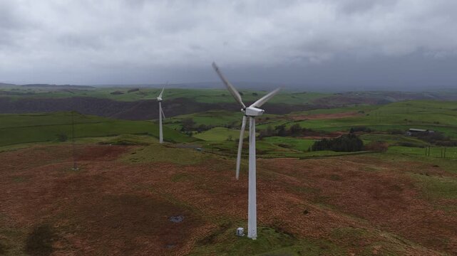 ind turbine in a Wales mountain landscape under cloudy weather