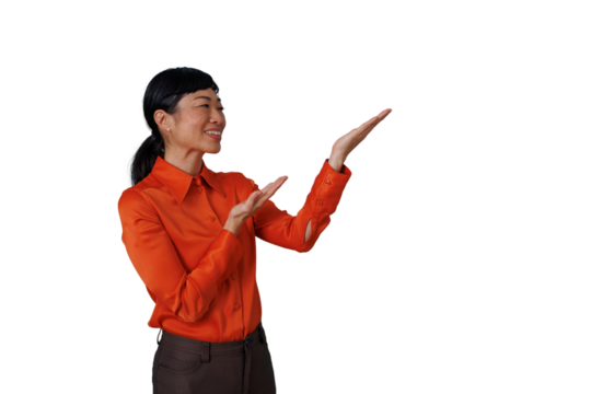 Asian businesswoman presenting idea with open hands, showing copy space, standing and smiling on transparent background - Powered by Adobe