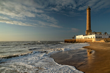 Obraz premium Chipiona, Spain. Chipiona Lighthouse on the Ocean Shore. Sea travel and tourism, Atlantic 