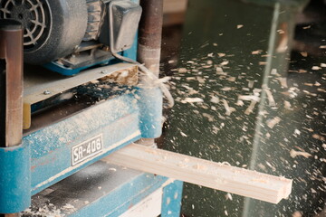 Wood Planer Machine Smoothing Lumber With Flying Wood Shavings