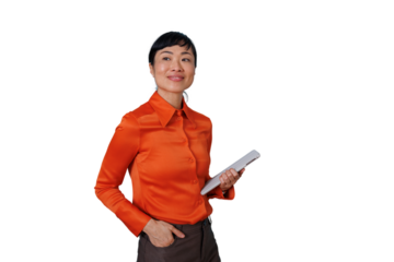 Asian businesswoman holding tablet, looking away while smiling confidently, standing on transparent background
