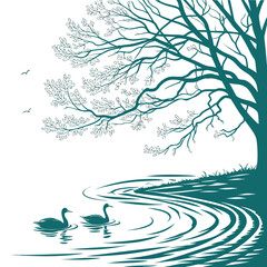 Two elegant swans glide peacefully on a rippling lake beneath a large tree with delicate branches and leaves © RUJINA