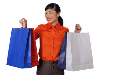Happy asian woman shopping, holding multiple colorful shopping bags, enjoying consumerism and...