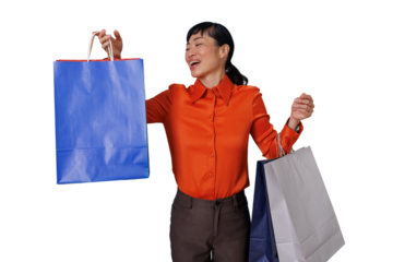 Happy asian woman celebrating success, embracing consumerism with colorful shopping bags, transparent background