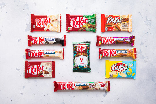 LONDON, UK - JUNE 07, 2025: Various Assorted KitKat chocolate wafer and crunchy biscuit bars on light table background.Top view.