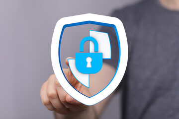 Secure data concept: person interacting with digital shield and lock, symbolizing protection, privacy, and cybersecurity in modern te