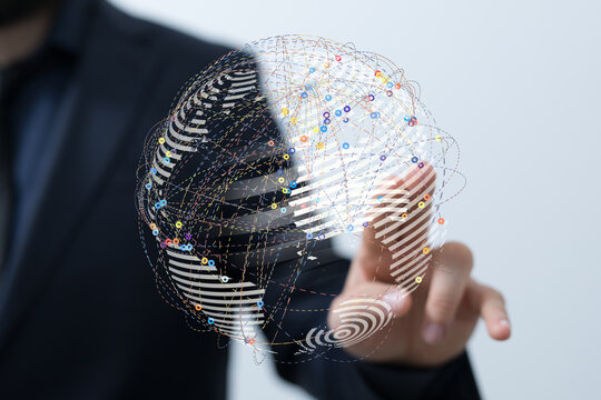 Conceptual image of a businessman touching a digital globe with connections, representing global communication and technology. Suitab
