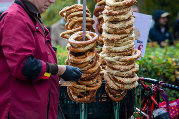 Fresh traditional pretzels sprinkled with cheese and salt.