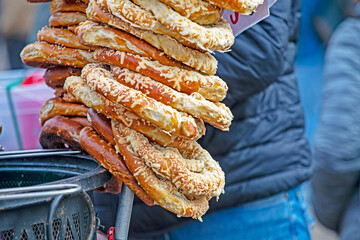 Fresh traditional pretzels sprinkled with cheese and salt.