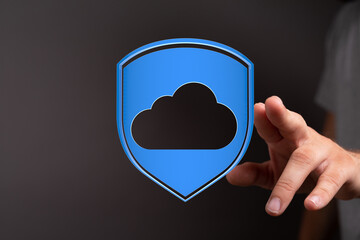 Fototapeta premium Abstract conceptual image of a hand interacting with a cloud security icon, representing data protection, safet