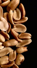Fried beans sprinkled with salt on a black plate. Graphic for illustration.