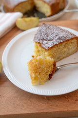 A piece of easy and fluffy apple sponge cake fresh and homemade bake on a plate