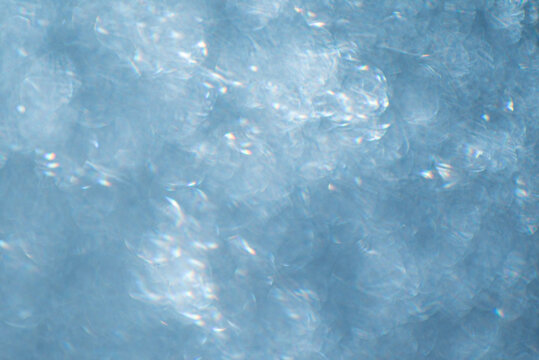 Gentle ripples create shimmering patterns on the surface, reflecting soft sunlight near the water - Powered by Adobe