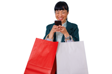 Smiling asian woman holding shopping bags and typing on smartphone, connecting with online retail, enjoying successful consumerism